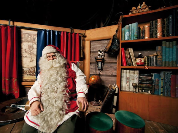 Funny Santa DJ mixes in the beams of light music for Christmas.