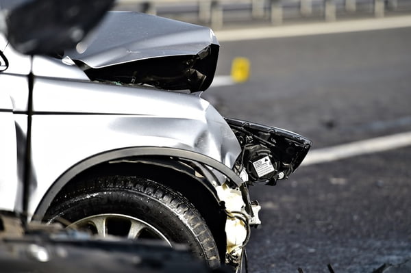 Car crash detail with damaged automobile