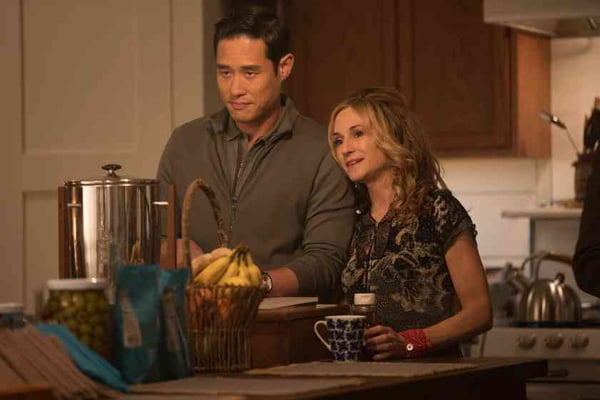 Raymond Lee as Duc and Holly Hunter as Audrey (mom of the family)