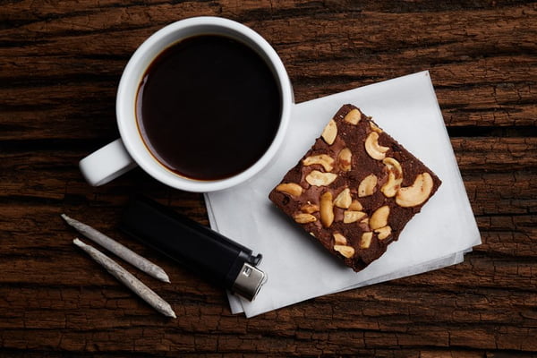 Coffee Break with brownie and marijuana joints set for relax