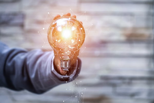 Business man holding light bulbs, ideas of new ideas with innovative technology and creativity