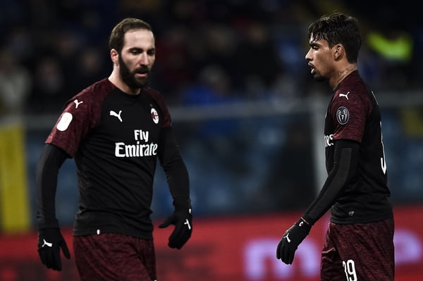Lucas Paquetá (R) and Gonzalo Higuain of AC Milan look on