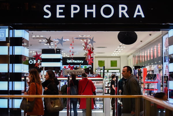 People are seen walking past the Sephora shop