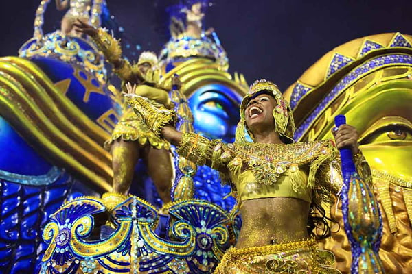 Samba muses from the Beija-Flor samba school parade from podiums on one of the schoolss impressive float at the famous Sambodromo at the Rio Carnival 2014