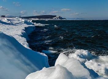 Scenic View Of Sea Against Sky During Winter