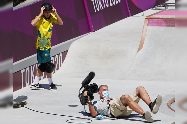 TOKYO, JAPAN - AUGUST 05: Kieran Woolley of Team Australia crashes into a TV Cameraman during the Men's Skateboarding Park Preliminary Heat 3 on day thirteen of the Tokyo 2020 Olympic Games at Ariake Urban Sports Park on August 05, 2021 in Tokyo, Japan. (Photo by Jamie Squire/Getty Images)