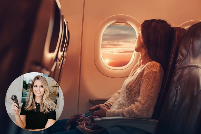Mulher sentada em avião olhando para a janela - Metrópoles