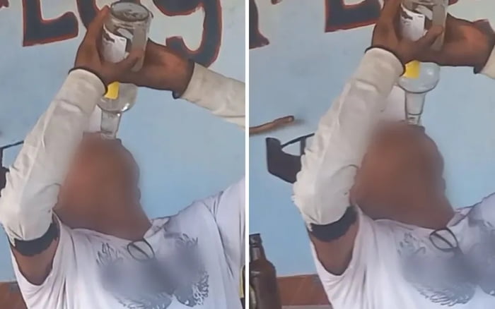 imagem colorida homem bebendo garrafa de cachaça em Goiás - Metrópoles