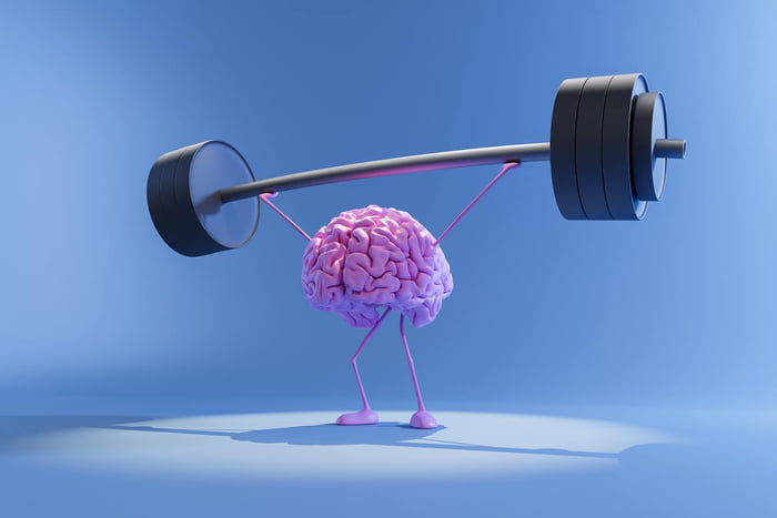 Foto colorida de um cérebro segurando uma barra de peso - Metrópoles